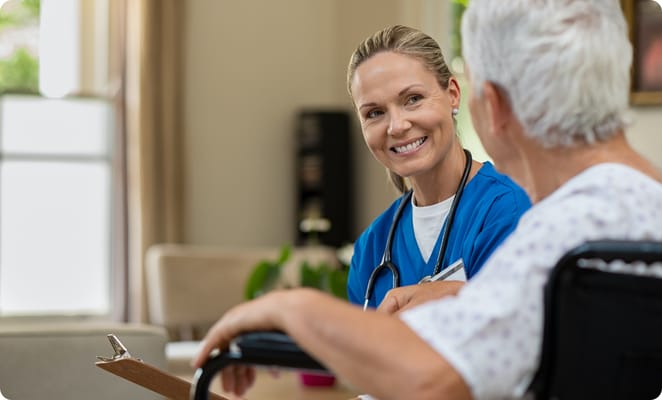 Healthcare professional smiling while interacting with a resident