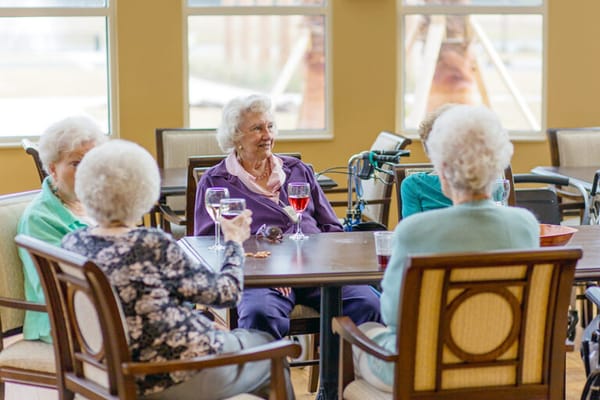 Residents enjoying refreshments in a common area