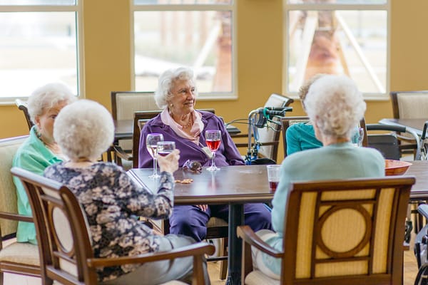 Residents enjoying refreshments in a common area