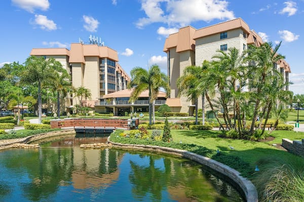Exterior view of The Inn at Freedom Square with landscaping and water features