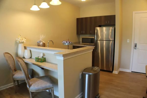 Interior view of a kitchen area in a senior living residence
