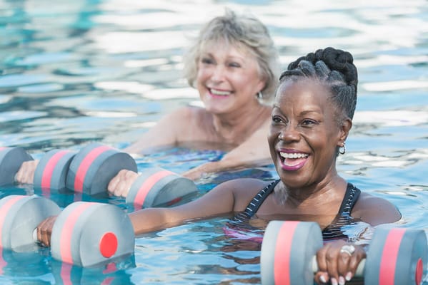 Residents participating in a water aerobics class