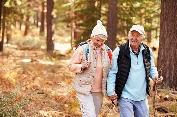 Senior couple enjoying a walk in a forest