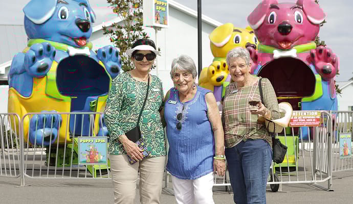 Residents enjoying outdoor activities near colorful attractions