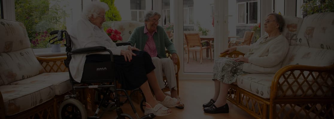 Residents enjoying conversation in a cozy sitting area
