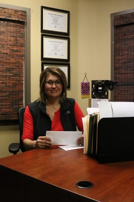 Staff member seated at an office desk