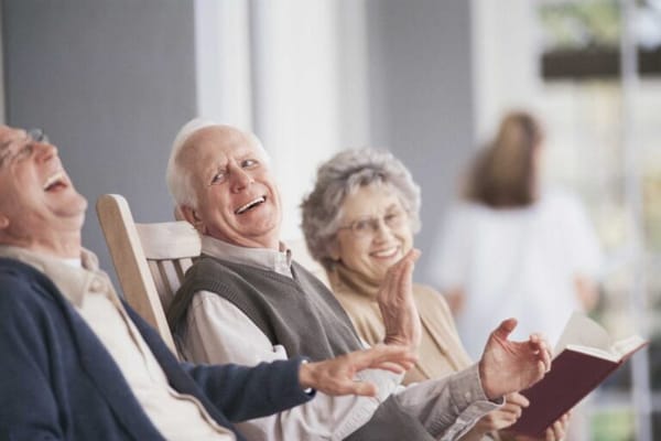 Residents enjoying a lighthearted moment in a common area