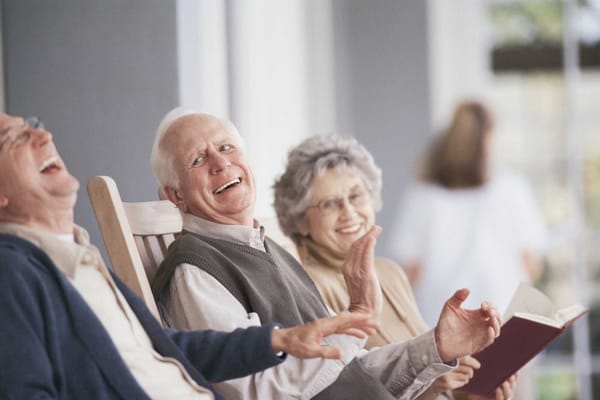 Residents enjoying a lighthearted moment in a common area