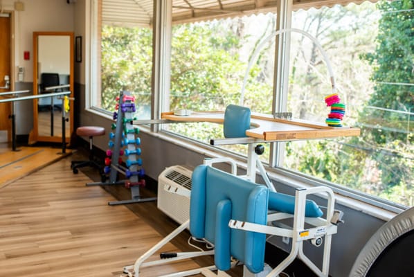 Therapy equipment in a bright, well-lit activity room
