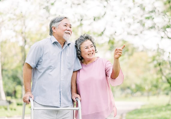 Elderly couple enjoying a walk in the park