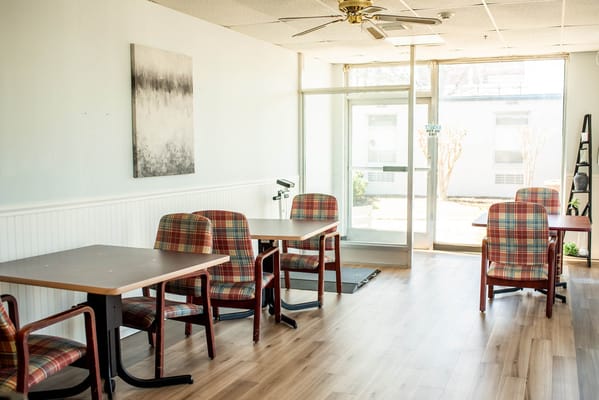 Interior view of a common area with tables and chairs
