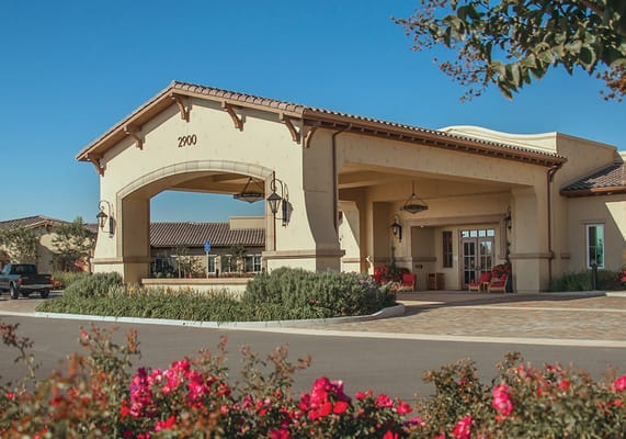 Exterior view of Creekview Assisted Living with flowers