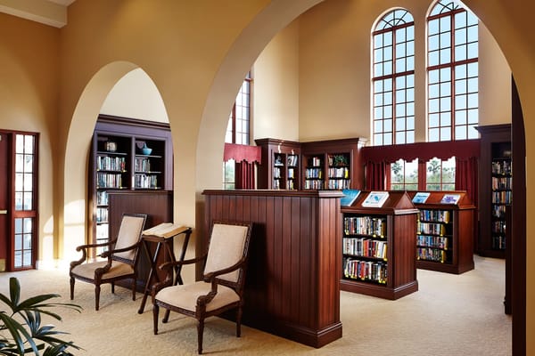 Bright library area with wooden shelves and seating