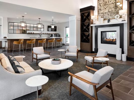 Modern common area with seating and fireplace