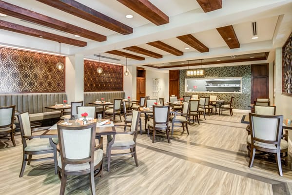 Interior view of a dining room with tables and decor