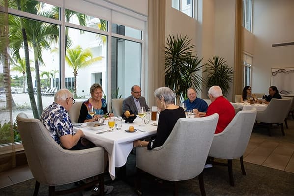 Residents enjoying a meal in the dining area