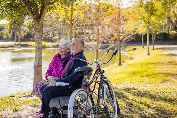 A senior couple enjoying a peaceful moment by the water