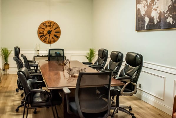 Meeting room with a large conference table and chairs