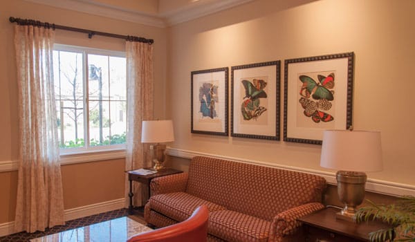 Cozy common area with butterfly artwork and soft lighting