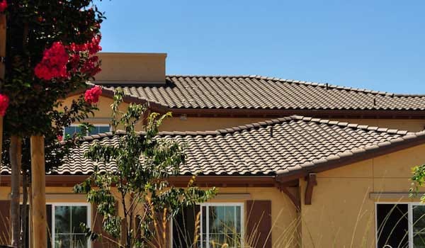 Exterior view of a residential building with flowers