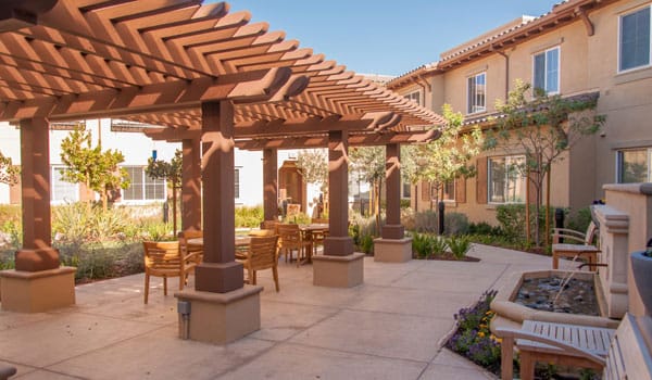Outdoor seating area with shade and landscaping