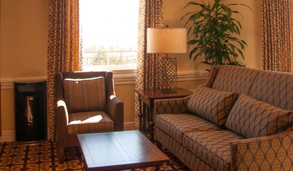 Cozy common area with seating and natural light.