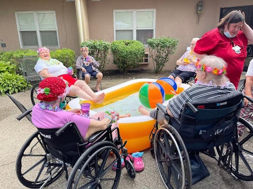 Residents enjoying a fun outdoor activity with a kiddie pool