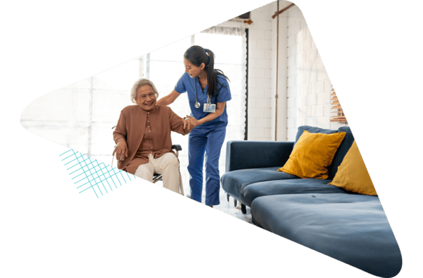 Caregiver assisting a resident in a cozy common area