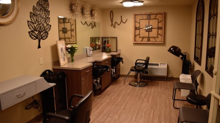 Salon area with styling stations and mirrors