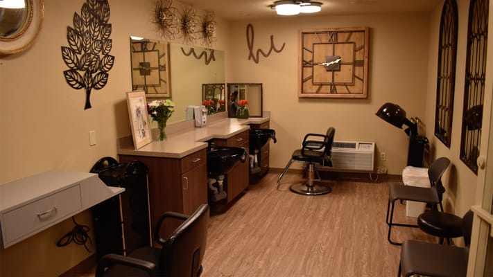 Salon area with styling stations and mirrors