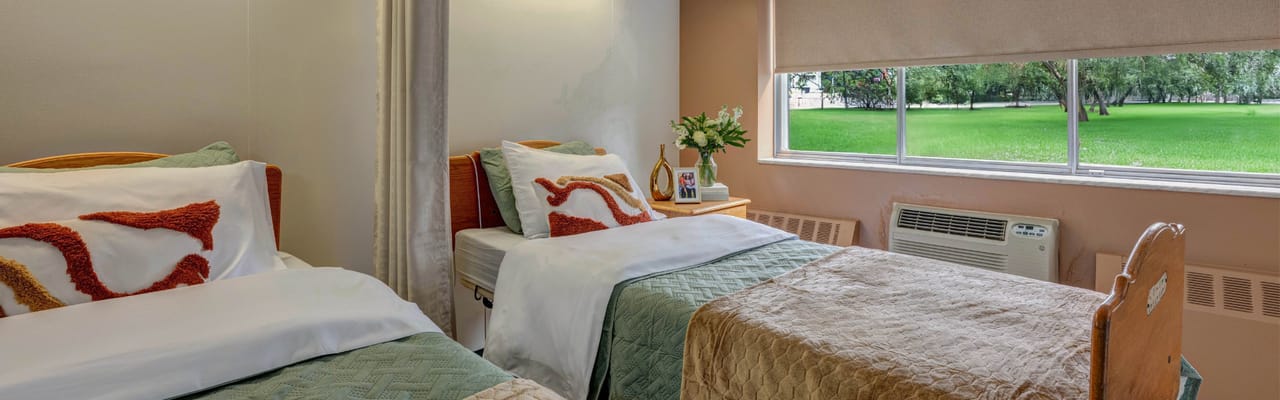 Cozy resident room with a view of green outdoor space