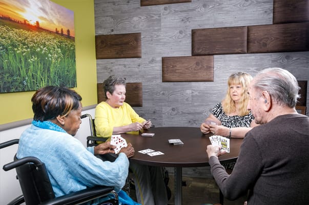 Residents playing cards in a communal area