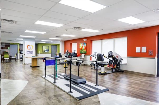 Interior view of a physical therapy room with equipment