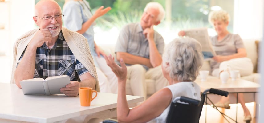 Residents engaged in conversation in a common area