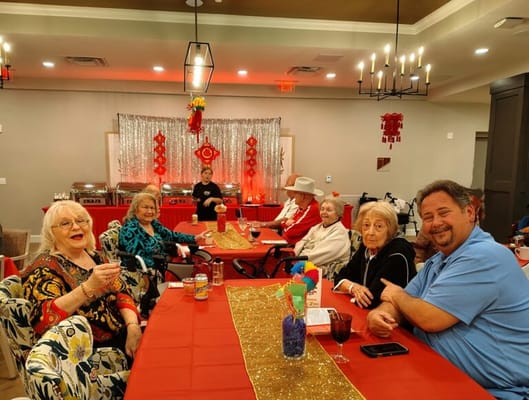 Residents enjoying a festive gathering in a common area