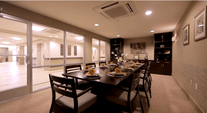Dining room set up with meal service in a cozy setting