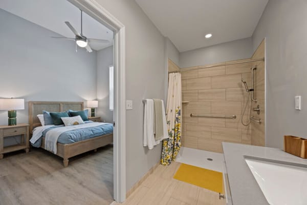 Brightly decorated private resident bathroom and bedroom