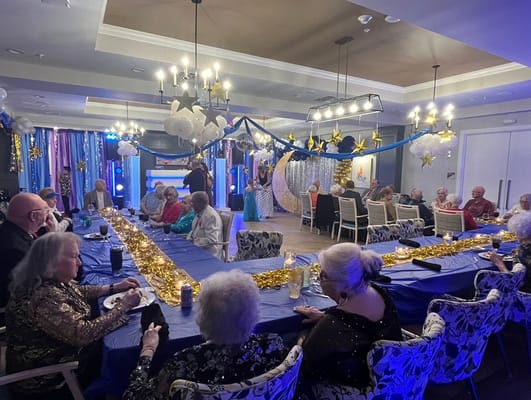 Residents enjoying a festive activity in the common area