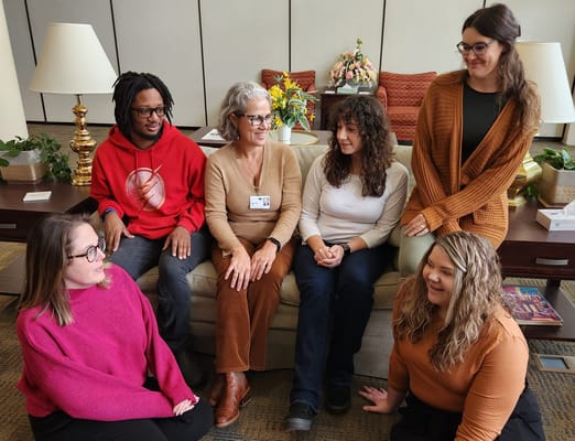 Staff members in a common area engaging with residents