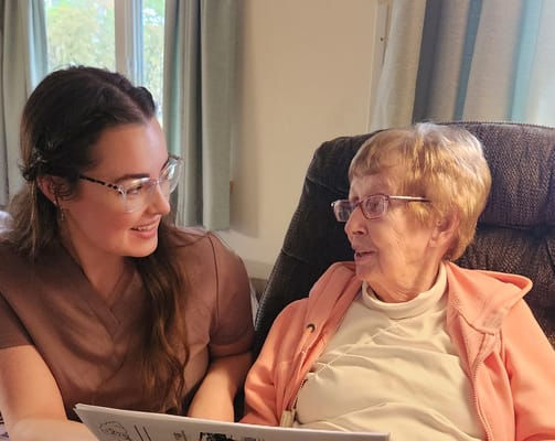 A caregiver and a resident enjoying a conversation