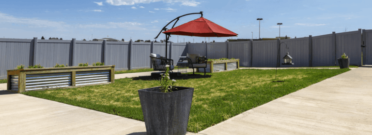 Outdoor garden area with seating and shade