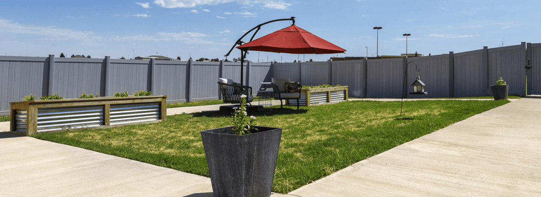 Outdoor garden area with seating and shade