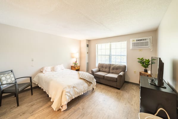 Well-furnished private resident room with natural light