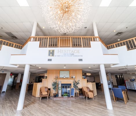 Brightly lit common area with decorative chandeliers