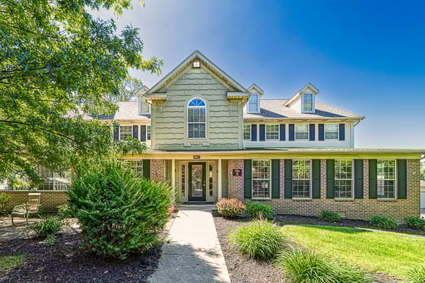 Exterior view of a senior living facility with landscaping