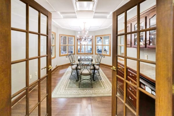 View of a well-lit common area with dining table