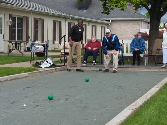 Residents enjoying outdoor bocce ball game