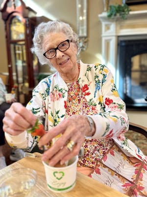 Resident enjoying strawberries in a common area