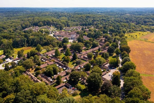 Aerial view of a senior living community surrounded by greenery