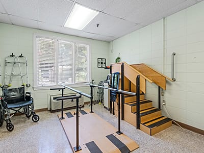 Rehabilitation area with stairs and parallel bars